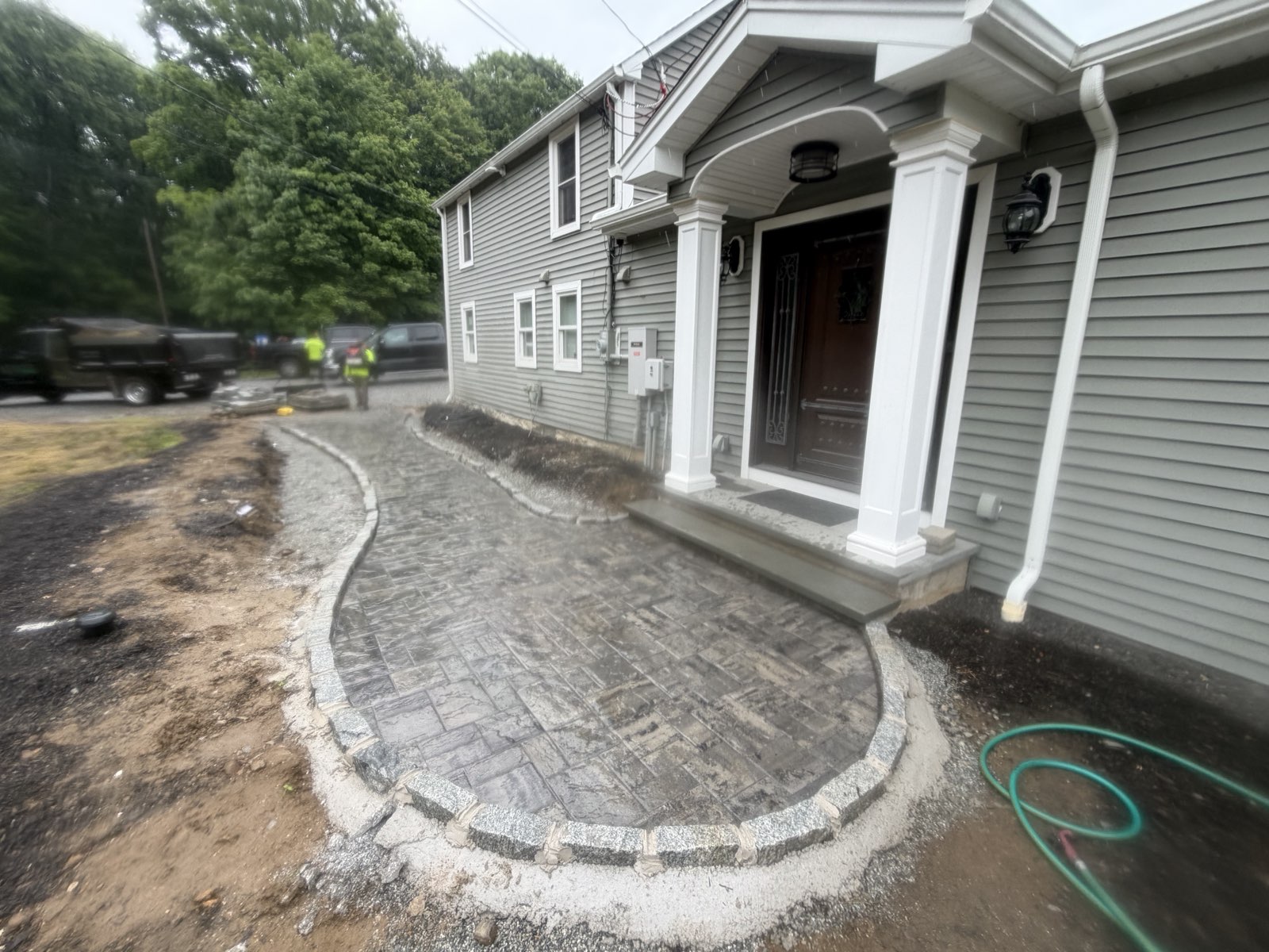 Curved paver walkway to a front door