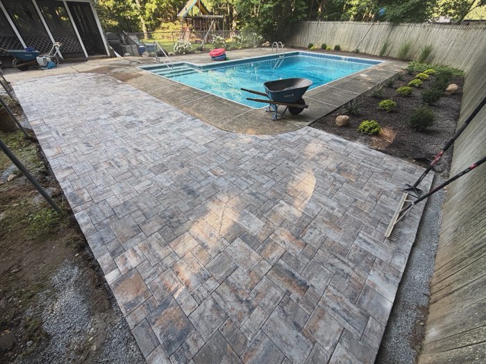 Paver patio around an in-ground pool