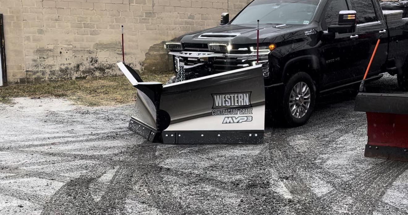 Pickup with plow mounted, ready for a storm